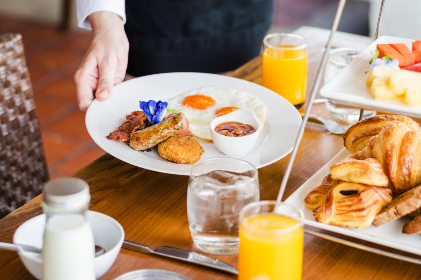 Hotel breakfast plate with eggs, toast and fruit